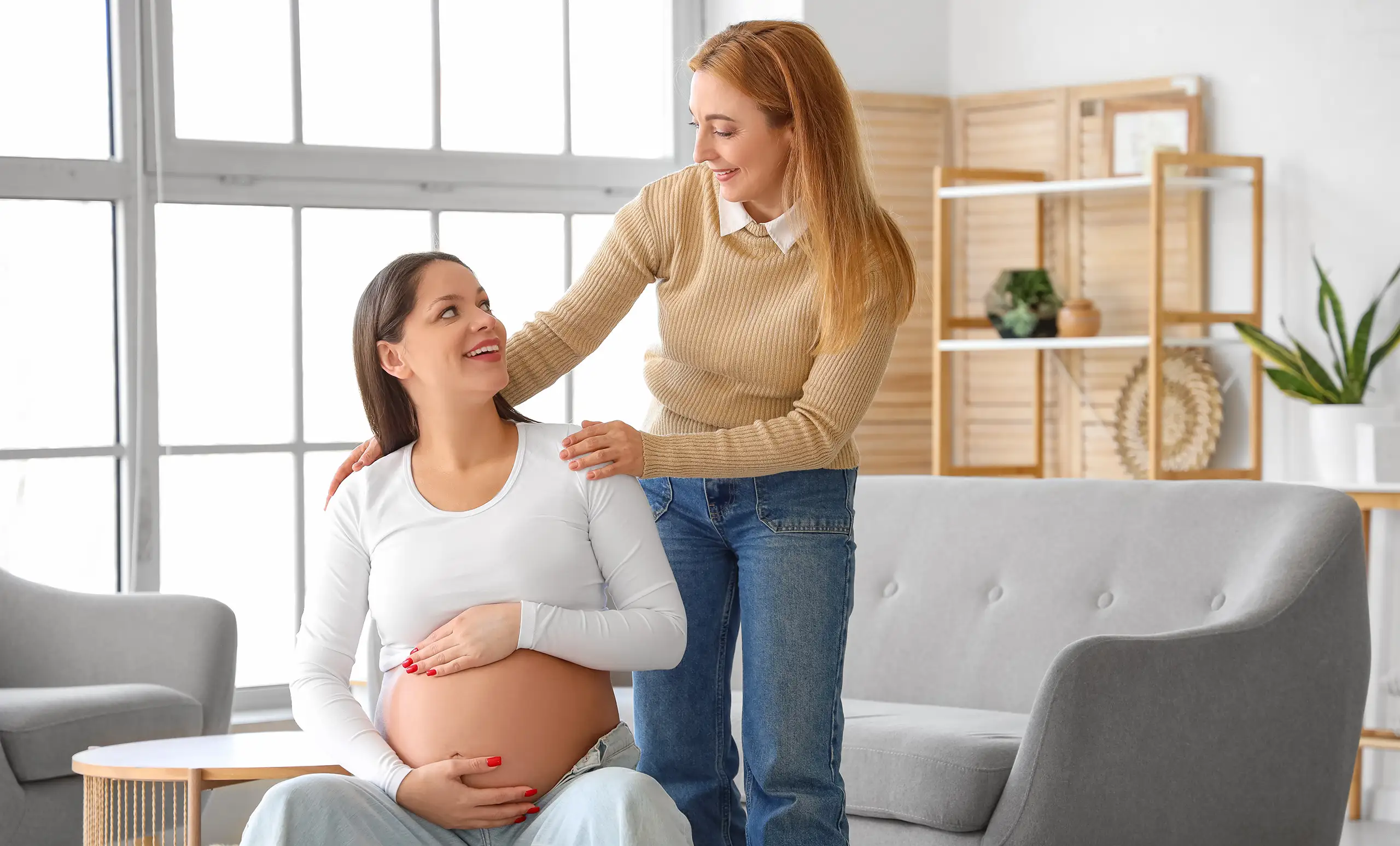 Birthing coach working with a pregnant woman