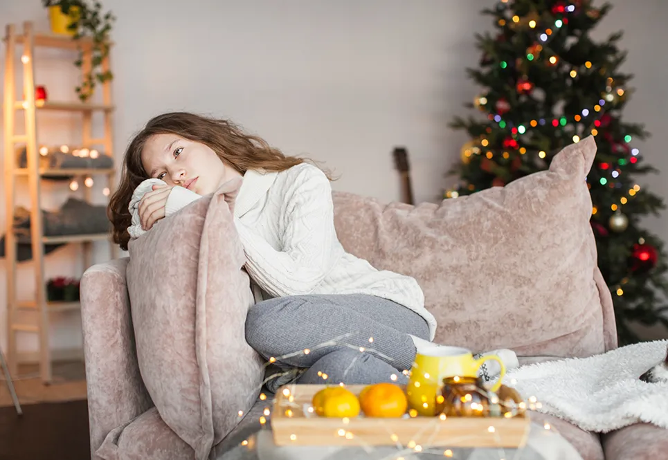 Caucasian teen girl feeling sad during the holidays.