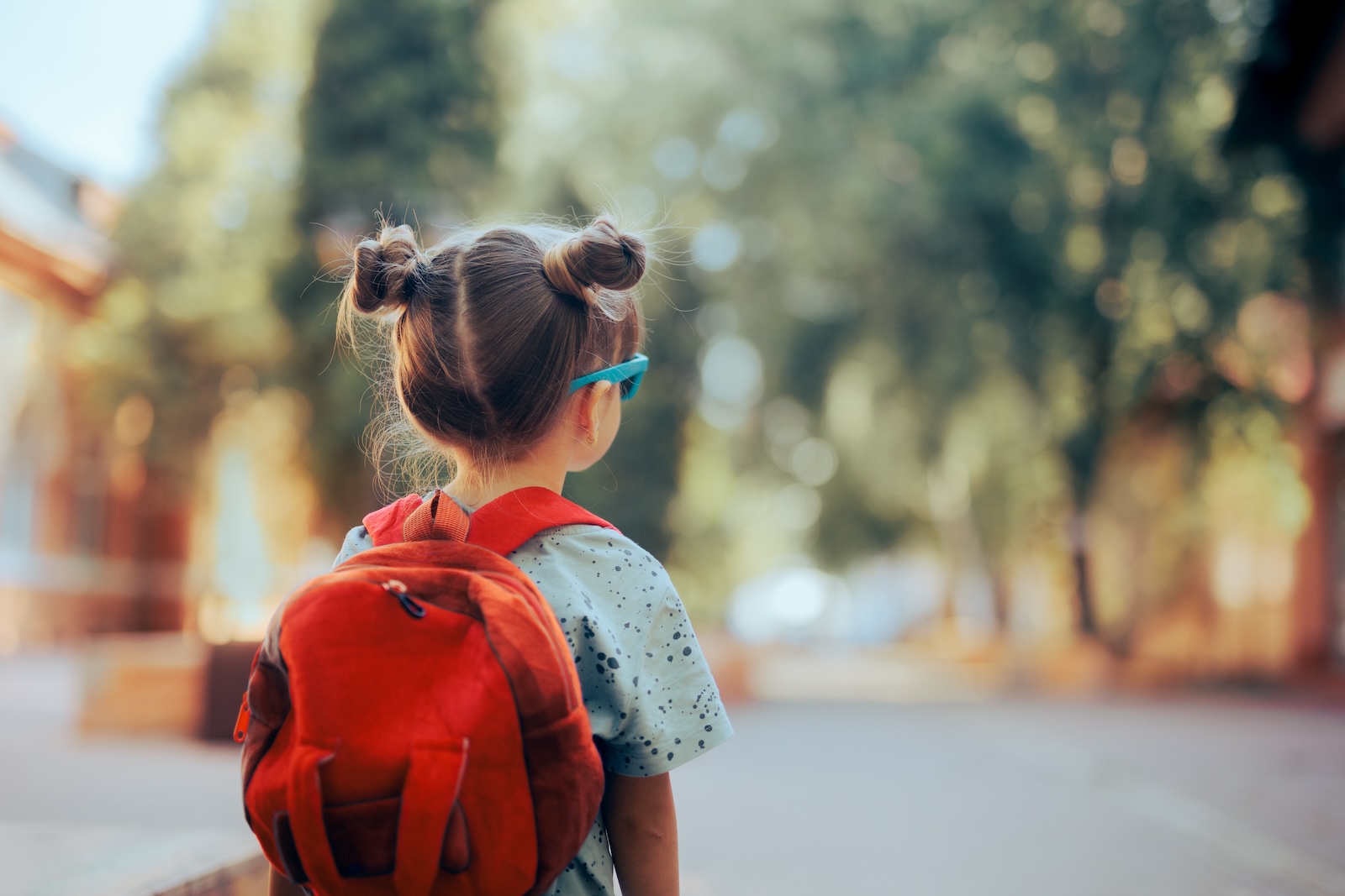 Cute toddler girl with a backpack