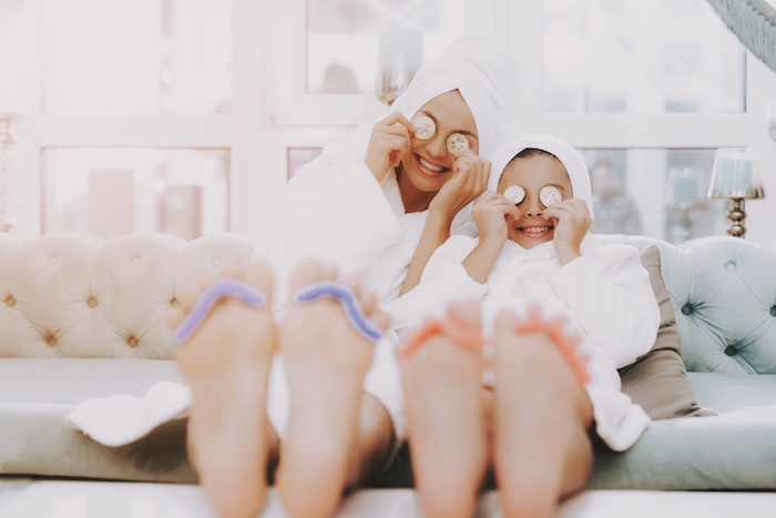 Mother and daughter having a mani/pedi together. 