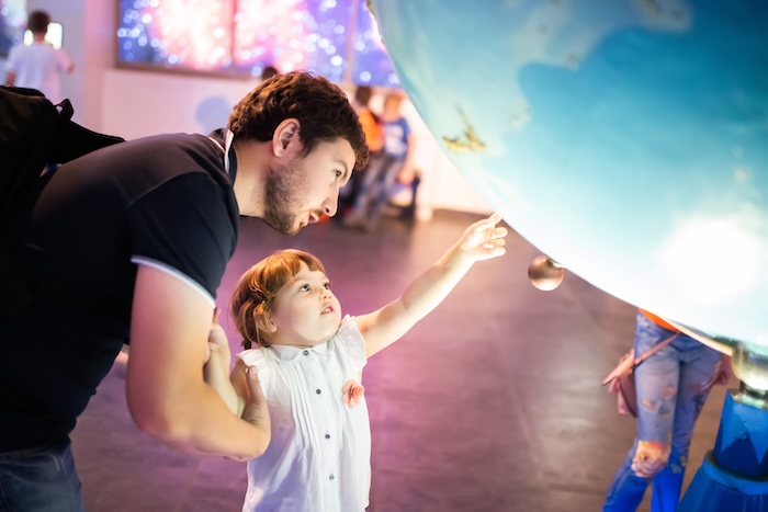 young child at a planetarium.