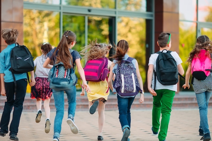 Young children heading back to school. 