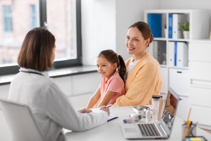 Parent discussing medical issues with their pediatrician.