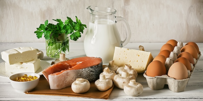 Healthy food sources of vitamin D, including eggs, salmon and mushrooms. 