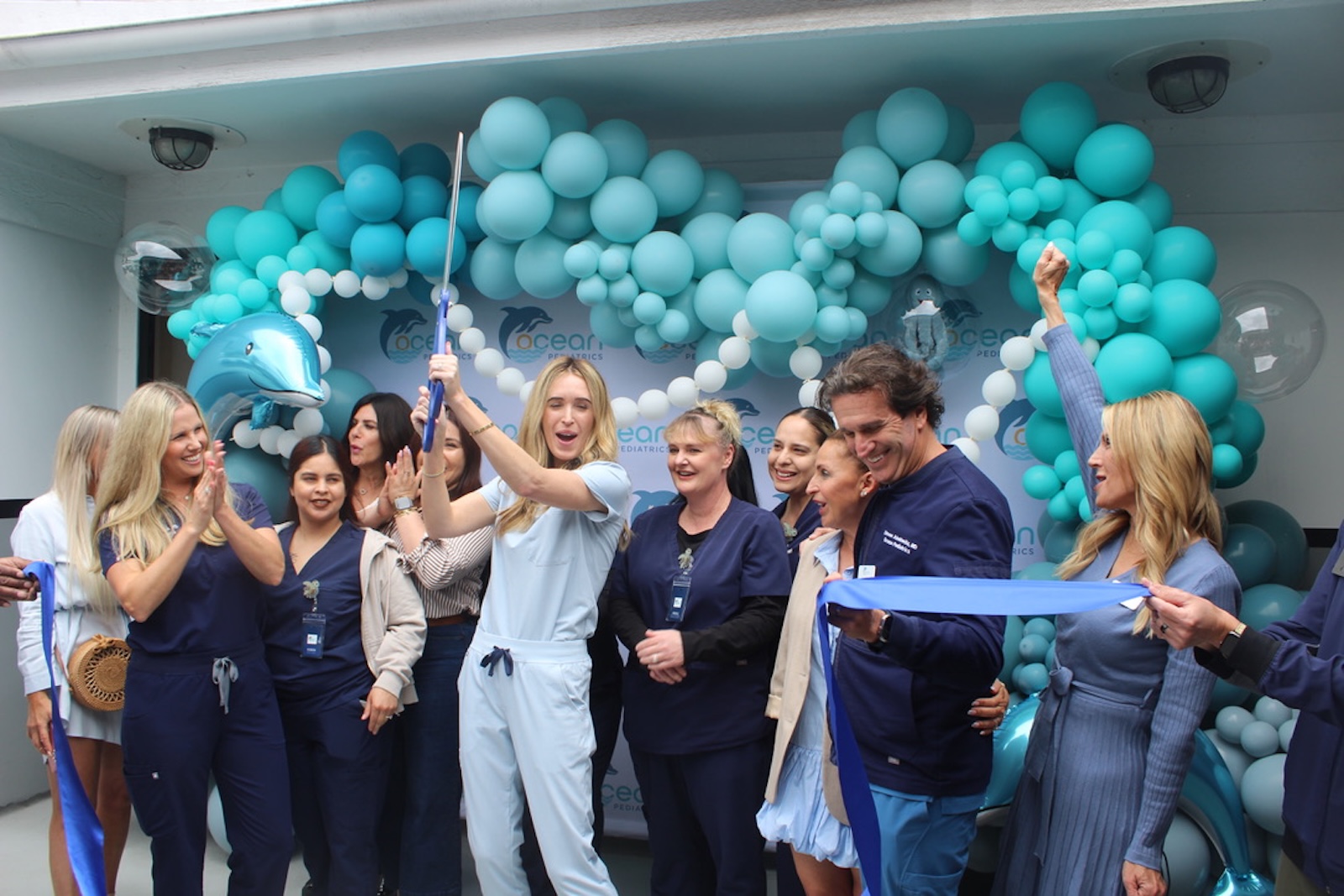 Wide shot of the Ocean Pediatrics team in their Orange County pediatric office.